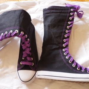 Black high tops canvas shoe with purple laces